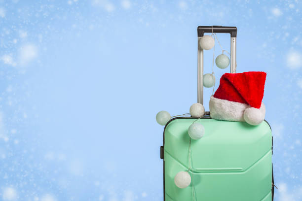 christmas hat on top of a suitcase